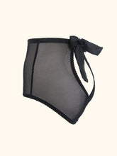 Load image into Gallery viewer, The back of the Serena open back knickers. There is a bow at the waist in the centre that fastens the knickers. The back panels over lap at the base and reveal the top of the bottom. All visible panels are made from black sheer mesh.