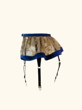 Load image into Gallery viewer, A side view of the Anna suspender. All 3 straps on one side are visible through and under the hem of the lace. The hem flutes gently.