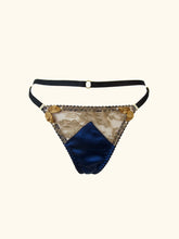 Load image into Gallery viewer, A product image of the front of the Anna thong. The gold floral lace is see through, the sides are deocrated with gold ribbon leaves tipped with small pearls.