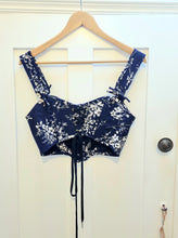 Load image into Gallery viewer, Back view of a pair of blue cotton stays showing the visible lace up back.