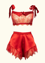Load image into Gallery viewer, The Olenska lace bralette worn with the Olenska tap pants. The red satin used in both is the same fabric and both feature red lace, each in a slightly different floral pattern.