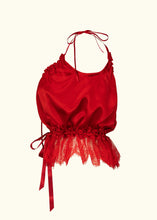 Load image into Gallery viewer, A side view of the red silk cami. The hem is trimmed with deep lace that starts at the waist and flares over the hips. the waist is gathered in on a red ribbon. The front and back necklines both scoop down an equal amount.