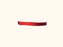 Load image into Gallery viewer, Back of garter. One strip of 12mm red elastic with one gold stider.