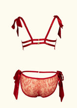 Load image into Gallery viewer, A back view of the Olenska Bralette and knickers. The red satin strap detail across the hips of the knickers, above where the lace scoops down echos the straps on the back of the bralette.