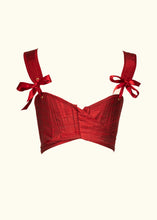 Load image into Gallery viewer, The back of the stays showing the wrap over fastening. The back neckline creates a sweetheart shape as it crosses over. The straps are attached by wide ribbons. The sash on the wrap over is the same fabric as the rest of the stays.