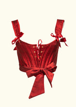 Load image into Gallery viewer, The front of the Olenska stays. The stays fasten with a wide wrap around sash tying in a big bow just off from the centre front. The stays and straps are finished with bias binding.