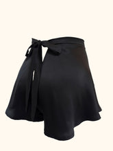 Load image into Gallery viewer, A back view of the Emmeline black silk tap pants showing the generous cut of the legs and the V shaped back.