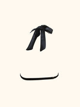 Load image into Gallery viewer, The back of the Sarah bralette in black. This shows the silk bow at the neck and the single adjustable strap going across the back.