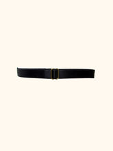 Load image into Gallery viewer, The back of a black garter. The back is formed of black satin elastic, around 1cm wide. The strapping is adjustable by way of a gold slider.