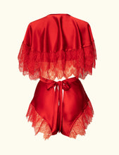 Load image into Gallery viewer, A back view of the Olenska tap pants and cape-let. Both use the same red silk and lace trim. This shows a styling option. The lace extends to the top of the waistband of the tap pants.
