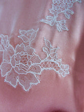 Load image into Gallery viewer, A close up on the delicate lace applique. This is machine stitched with a very small zig zag stitch, matching the lace.