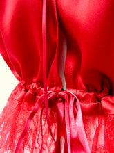 Load image into Gallery viewer, A close up on the gathers and ribbon fastening at the waist of the Olenska cami. the front opening is finished with a narrow fold over seam on the silk and lace.