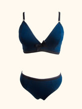 Load image into Gallery viewer, A shot of the Artemis bralette and thong on a stand, showing the matching contrasting underbust band and waistband.