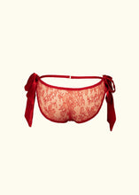 Load image into Gallery viewer, The back of the Olenska lace knickers. The lace is a floral chantilly. The hip line strap joins to a gold ring in the centre. The side bows hang down on either side of the hips. They attach to the main body of the knickers with small gold rings.