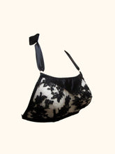 Load image into Gallery viewer, The Sarah bralette in black. The lace is heavier and corded, the rosettes at the neck are made from lace trim.