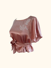 Load image into Gallery viewer, The Sarah silk lounge top has a waist tie and wide capped sleeves. There is floral, cream applique at the side of the neck.