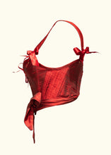 Load image into Gallery viewer, The side of the Olenska stays. This shows the change in length from the back to the front of the stays. The stays are short at the back, sweeping around to the waist at the centre front.