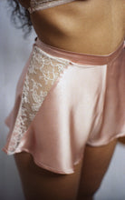 Load image into Gallery viewer, This side view shows the inverted triangle panel of lace at the side of the tap pants, it is around 4 inches wide at the waistband, and half an inch wide at the hem. The waistband is around 1 inch wide and sits on the waist. The silk falls in folds from the waist.