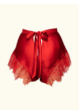 Load image into Gallery viewer, A back view of the Olenska tap pants. The back fastens with a bow that leads out of the 1 inch wide waistband. There is a triangular cut out beneath the bow that exposes some of the lower back.