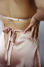 Load image into Gallery viewer, A close up of the back of the Sarah tap pants. They fasten with a bow that extends from the waistband and is around 1 inch wide. There is a triangular cut out beneath the bow that shows the lower back.