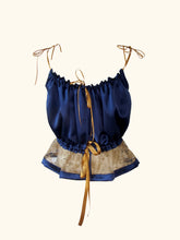 Load image into Gallery viewer, Back product photo of the blue silk camisole. A thin ribbon secures the back neckline and thicker ribbon secures the waist. Both tie in bows at the centre back.
