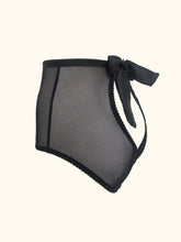 Load image into Gallery viewer, The back of the Serena open back knickers. There is a bow at the waist in the centre that fastens the knickers. The back panels over lap at the base and reveal the top of the bottom. All visible panels are made from black sheer mesh.
