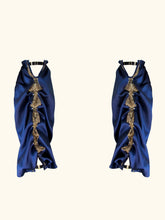 Load image into Gallery viewer, A product image of the front of the sleeves. The sleeves are gathered down the inner arm seam creating an attravtive drape. The have straps at the wrist and top of arm that fasten with gold g hooks.
