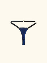 Load image into Gallery viewer, A back product image of the Anna thong. The back is blue stretch silk edged in black picot elastic. The straps are black. The waist strap features a gold ring detail in the centre of the strap. All straps are adjustable.
