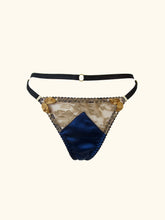 Load image into Gallery viewer, A product image of the front of the Anna thong. The gold floral lace is see through, the sides are deocrated with gold ribbon leaves tipped with small pearls.
