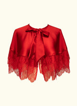 Load image into Gallery viewer, The front of the Olenska tiered cape-let. The cape is a short circle cape with two layers and a large bow at the neck. The two layers are trimmed with a deep frill of Chantilly lace. The cape extends to around elbow length.
