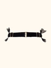 Charger l&#39;image dans la galerie, The back of a black choker with a central black satin elastic band. The tulle frills stop at the sides and the band becomes adjustable with gold sliders. The back fastens with a G Hook.
