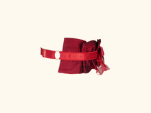 Load image into Gallery viewer, side view of dark red choker. The ruffles extend half way round the neck. The back is red lingerie elastic with gold hardwear.
