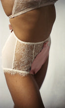 Charger l&#39;image dans la galerie, The ouvert knickers from the side front. The front is lace and silk with a ribbon rosette decoration. The back is pale pink mesh. There are small frills of lace at the top of the legs. 

