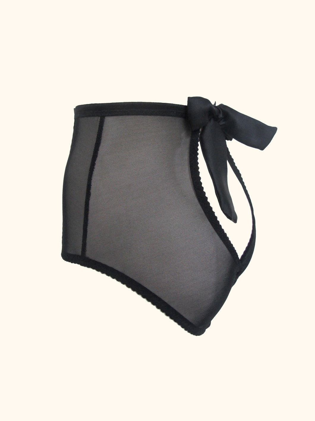 The back of the Serena open back knickers. There is a bow at the waist in the centre that fastens the knickers. The back panels over lap at the base and reveal the top of the bottom. All visible panels are made from black sheer mesh.