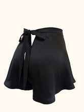 Cargar imagen en el visor de la galería, A back view of the Emmeline black silk tap pants showing the generous cut of the legs and the V shaped back.
