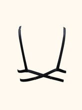 Load image into Gallery viewer, The Nina bralette back view. Showing the shoulder straps looping over the band. The band then crosses over at the centre back. The gold sliders on the shoulder and band straps are visible.

