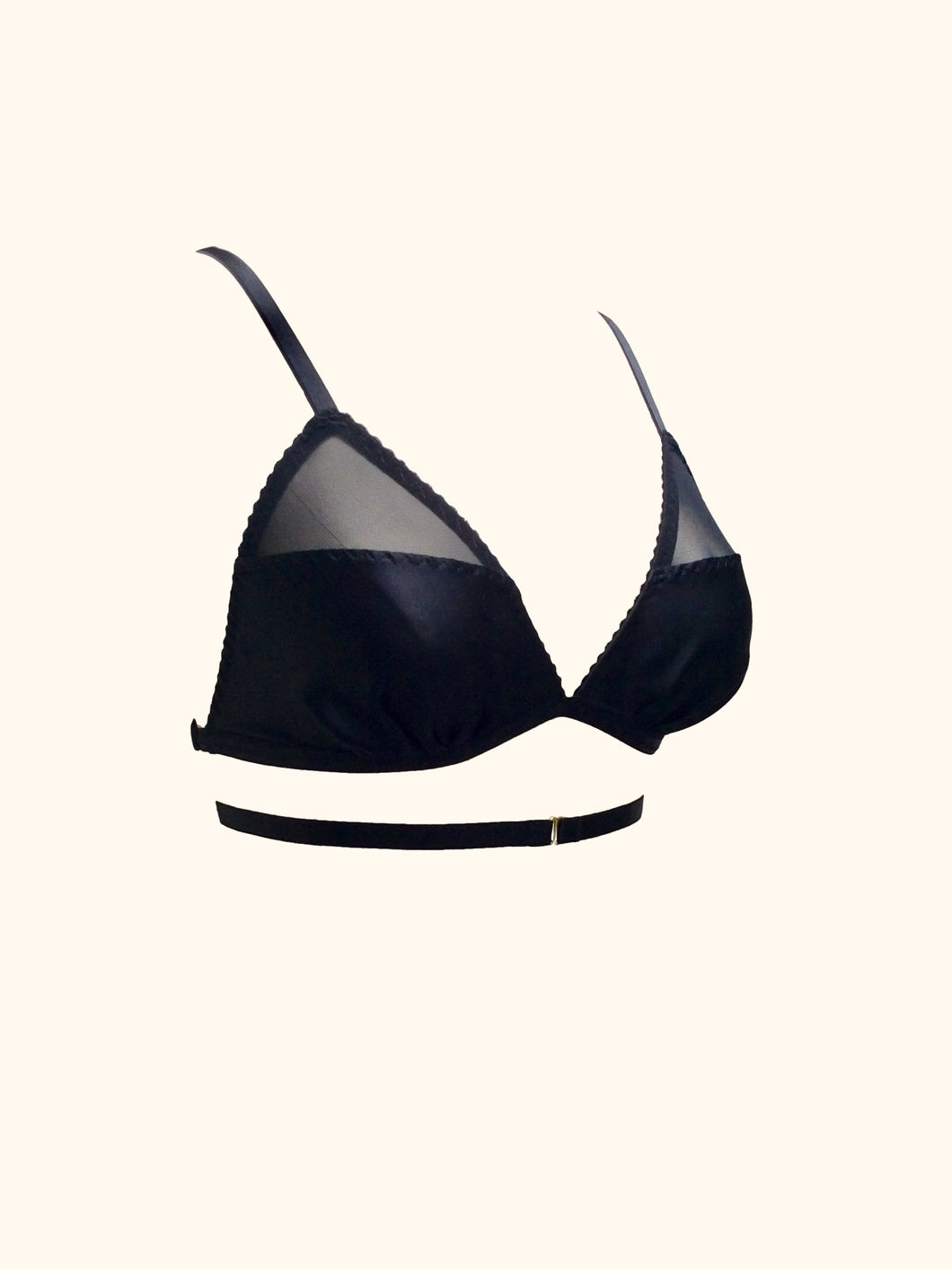 Side front view of the Nina wrap around bralette. The cups are gathered silk at the base with an angled seam that leads to a triangular black mesh panel at the top of the cup. The mesh is around 1 third of the total cup.