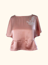 Load image into Gallery viewer, The front of the Sarah lounge top with no waist tie. There is a seam below the bust and the bottom panel gathers into it, the gathers are concentrated to the side, with the front quite flat.
