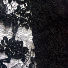 Load image into Gallery viewer, A shot of the heavier black corded lace and black silk satin used in the black option.
