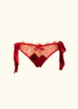Cargar imagen en el visor de la galería, The Olenska lace knickers from the front. The sides fasten with double side bows in red satin which hang down by the hips. The knickers are hips level and feature a crossover silk panel design at the crotch. There is a bow trimming the hip line.
