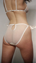 Charger l&#39;image dans la galerie, The back of the Lily knickers. The back is mesh with a small keyhole detail at the centre back. The keyhole is joined with a small gold ring. The same gold rings attach the side bows.
