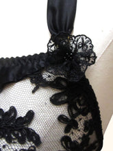 Charger l&#39;image dans la galerie, A close up of the black lace rosettes on the black Sarah bralette. The centre is decorated with black glass beads.
