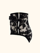 Load image into Gallery viewer, The side of the Sarah black knickers. Showing the 2 silk covered buttons and loops that fasten the side. The waistband is secured by a gold g hook.
