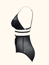 Load image into Gallery viewer, A side view of the Nina bralette with the Serena knickers. This shows the band strap on the bralette looking back around the body and the gold ring used to attached the adjustable band straps to the cups.
